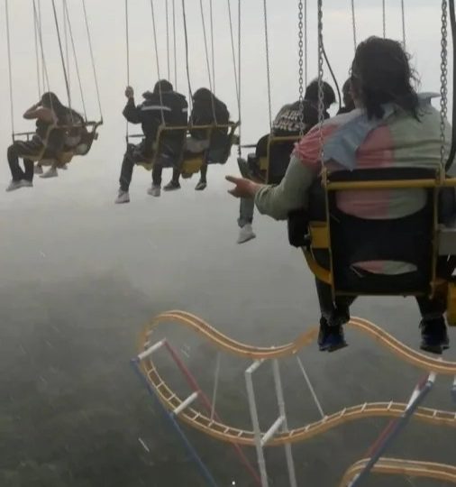 Watch terrifying moment thrill-seekers are left dangling 250ft in the air during storm after Six Flags ride breaks down