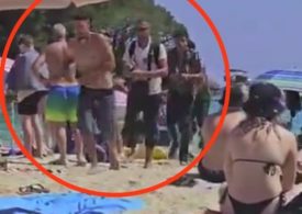 Moment haggard migrants step over stunned tourists on packed Brit holiday beach in MAJORCA after perilous 170 mile trip