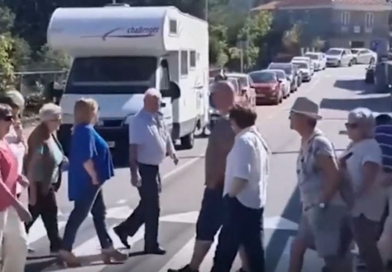 Watch moment anti-tourist campaigners continually use zebra crossing to block beachgoers in most BIZARRE protest yet