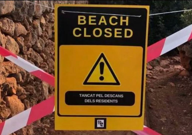 Anti-tourist fanatics tape off beaches with FAKE closure signs in Majorca to stop holidaymakers visiting popular coves