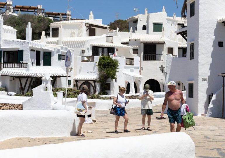 Menorca town dubbed ‘Spain’s Mykonos’ holds referendum on BANNING tourists after being ‘trapped’ in homes by influencers