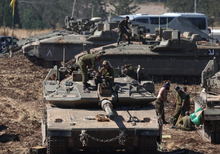 Israeli forces poised to pour into Lebanon as tanks mass at border & 1000s more troops called up after terror boss hit