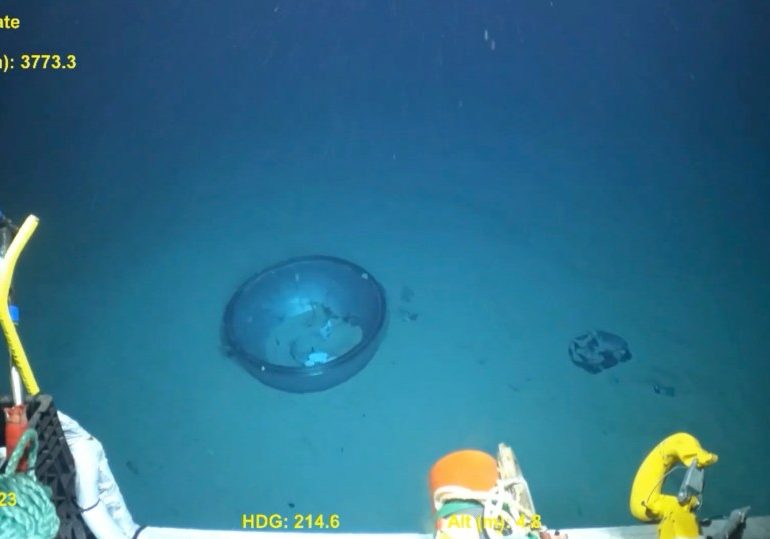 Chilling new vid of doomed Titan sub wreckage strewn across ocean floor shows dome crew peered through before implosion