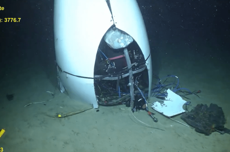 Chilling first video of doomed Titan submarine wreck shows mangled craft on ocean floor after devastating implosion