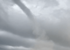 Watch moment towering waterspout tornado slams into beach sending bathers fleeing running and hurling tables & chairs