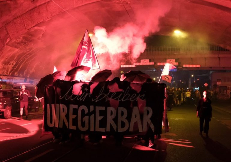 Furious protests erupt in Germany as masked demonstrators fire flares after far-right AfD claim biggest win since WW2