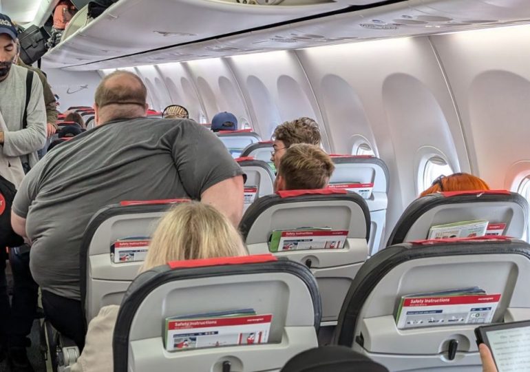 Online trolls cruelly shame plus-size man after passenger snaps secret pic of him in plane seat row