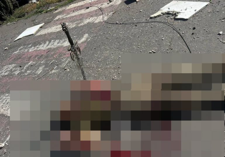 Outrage as sick Russian soldiers execute unarmed Ukrainian prisoner with a SWORD with chilling inscription