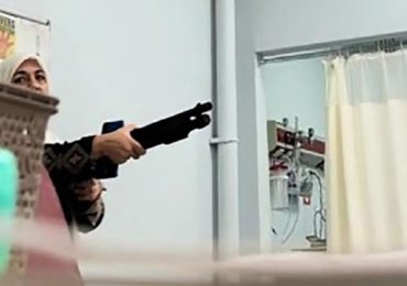 Horrifying moment shotgun-wielding woman holds up children’s hospital threatening to kill staff & vowing she had a bomb