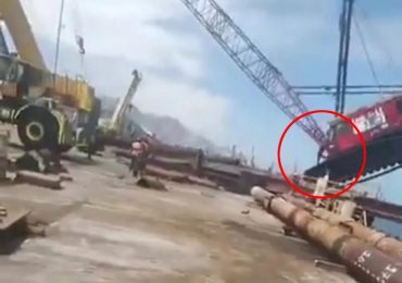 Dramatic moment huge crane collapses as its driver jumps out in nick of time & narrowly avoids being crushed to death