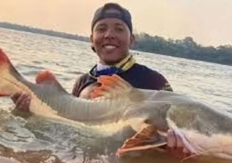 Man, 23, drowns after hooking monster fish & losing his balance as he pulled it out water in front of horrified pals