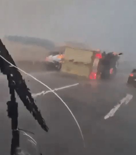 Horror moment TORNADO topples lorries in Spain during deadly floods as trucker filming vid screams ‘I’ve s**t myself’