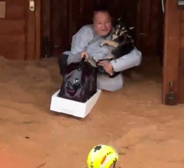 Watch nerve-racking moment terrified Spanish woman and her beloved dog are airlifted from deadly floodwater