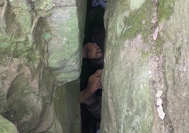 Moment hiker is found UPSIDE DOWN between two rocks in Australian outback after getting trapped trying to find her phone