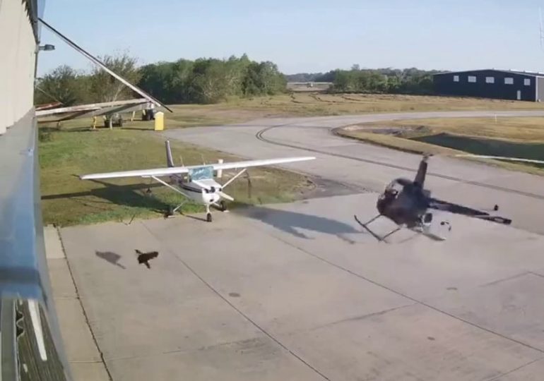 Watch terrifying moment helicopter crashes into plane sending rotor blades flying – but pilot miraculously WALKS away