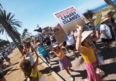 Furious anti-tourism protesters storm beach at Brit holiday hotspot leaving sunbathers shocked