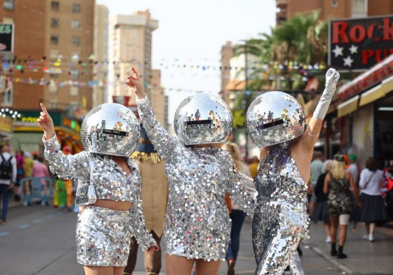 Watch as 30,000 Benidorm Brits take to streets & march in fancy dress to raise funds for horror Spain storm victims