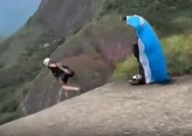 Horror moment skydiving instructor walks to his death off cliff in front of horrified thrillseekers in stunt gone wrong