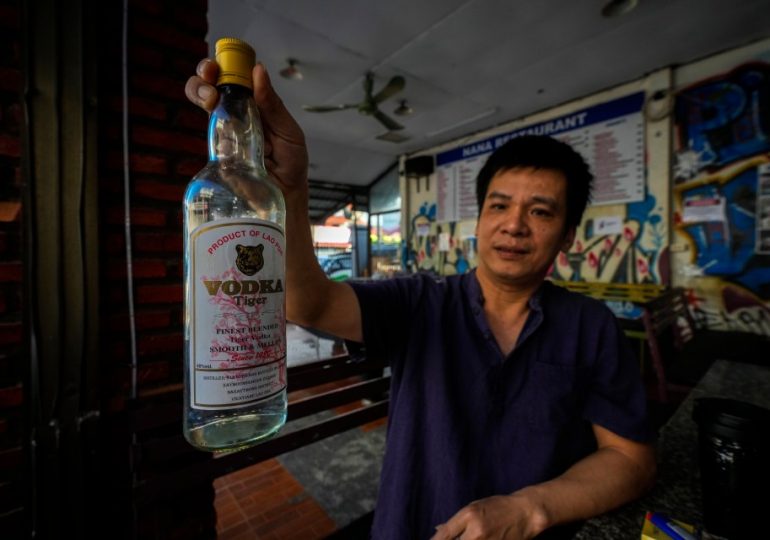 ‘World’s cheapest’ 36p-a-bottle booze may have killed 6 tourists after ‘error at communist government factory’ in Laos