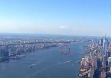 Eerie moment mysterious ‘UFO’ is caught on live TV as bizarre orb zooms past New York skyline in chopper cam footage