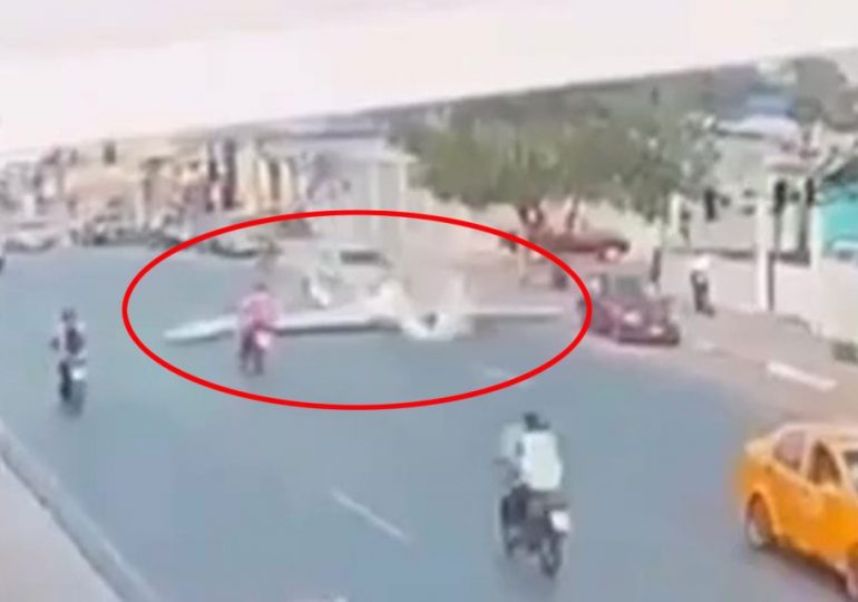 Horror moment plane drops from the sky like a stone and crashes onto busy road killing two on board & injuring biker