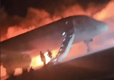 Terrifying moment plane goes up in flames after landing at Antalya airport as families escape down emergency slides