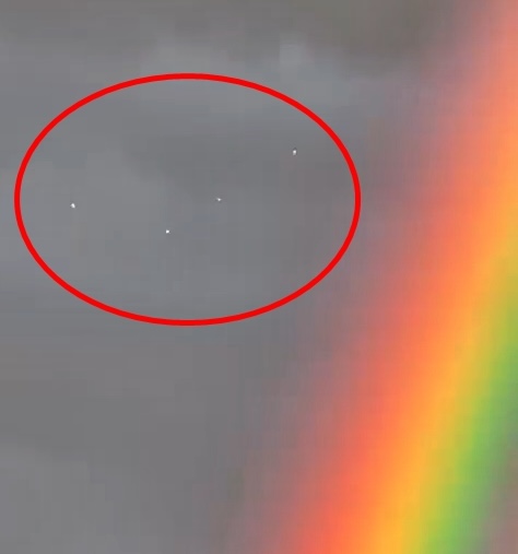 Eerie moment UFOs appear in sky above Spain next to double rainbow – before deadly flash floods hit