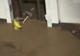 Moment ‘hero’ teacher smashes door with table leg to rescue kids as young as 5 trapped in school by rising Spain floods