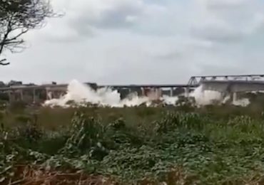 Horror moment 1,750ft bridge COLLAPSES killing two as seven vehicles including ACID tanker plummet into river in Brazil