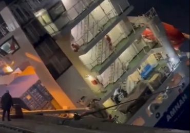 Watch terrified crew desperately try to escape CAPSIZING cargo ship before it flips & containers topple into port