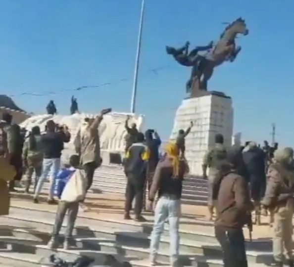 Watch as rampaging Syrian Islamist rebels tear down Assad statue in ‘Saddam moment’ & burn Russian flag ‘for Allah’