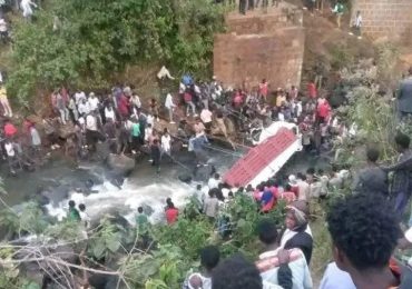 At least 71 killed in devastating bus crash after overloaded vehicle packed with WEDDING guests plunges into river