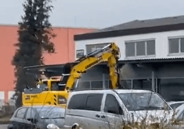 Watch terrifying moment stolen digger goes on RAMPAGE as armed cops shot driver dead in chaotic footage