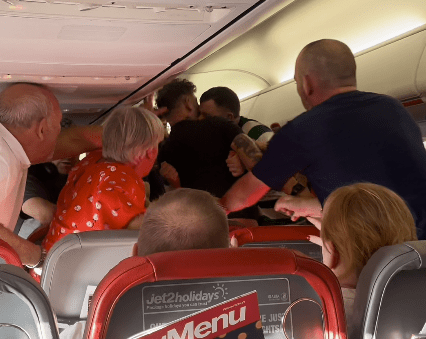 Watch moment drunken passengers brawl on Jet2 flight to Leeds as one tries to ‘bite the other’s neck & gouge eyes out’