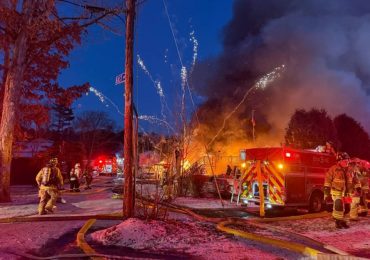 Terrifying moment barrage of fireworks launch from huge house blaze as firefighters battle inferno