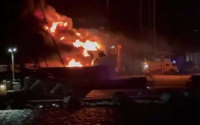 Horror moment £12MILLION luxury superyacht erupts into flames & is destroyed while anchored in paradise resort