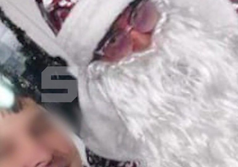 Moment assassin disguised as Santa poses for selfie with unsuspecting target – before pulling out gun and opening fire