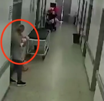 Horror moment ‘cradle snatcher’ is seen fleeing from hospital with newborn baby wrapped in arms after posing as nurse