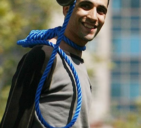 Incredible photo showing Iranian prisoner grinning moments before he was executed resurfaces after two judges shot dead