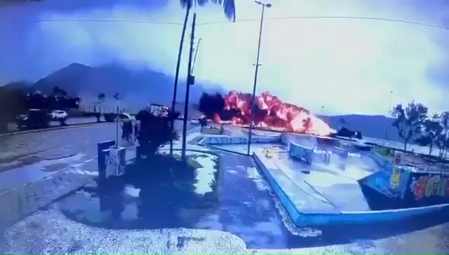 Horror moment plane smashes into road in fireball explosion killing pilot & injuring at least 7 after missing runway