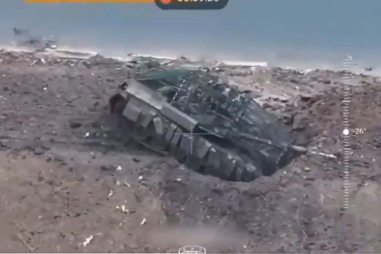 Watch moment panicking Russians drive £4million tank into a DITCH as they desperately try to escape Ukrainian drones