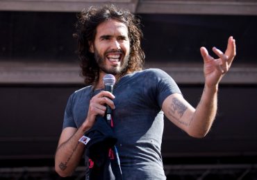 Russell Brand’s first appearance since rape charges AXED as US college cancels ‘free speech’ talk…but blames ‘logistics’