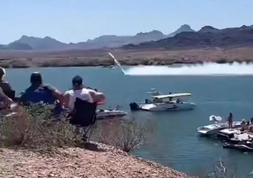 Watch as out-of-control speedboat hurtles through air at 200mph before smashing into lake in front of stunned crowd