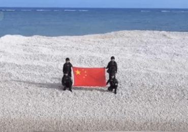 Brazen China plants flag on seized TINY 2,000sq ft sandbank in WW3 flashpoint sea…before Philippines’ tit-for-tat reply