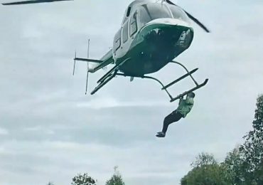 Watch bizarre moment man clings to helicopter as it takes off at lavish wedding after ‘begging for a ride’