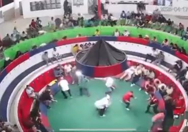 Horror moment gang dressed as soldiers open fire on spectators at cockfighting ring, killing 12 as they scream in terror