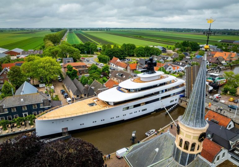 Plush £150m superyacht laden with luxuries like jacuzzi & helipad owned by ex-Starbucks CEO squeezes through Dutch canal