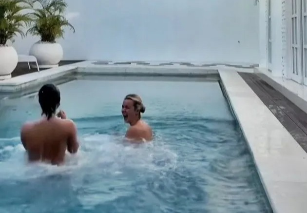 Moment skinny dipping pals dive naked into pool they thought was their private sanctuary – before making shock discovery
