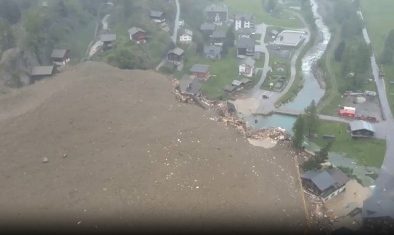 Swiss town BURIED after horror avalanche thunders down mountain in huge landslide & submerges homes & causes evacuation