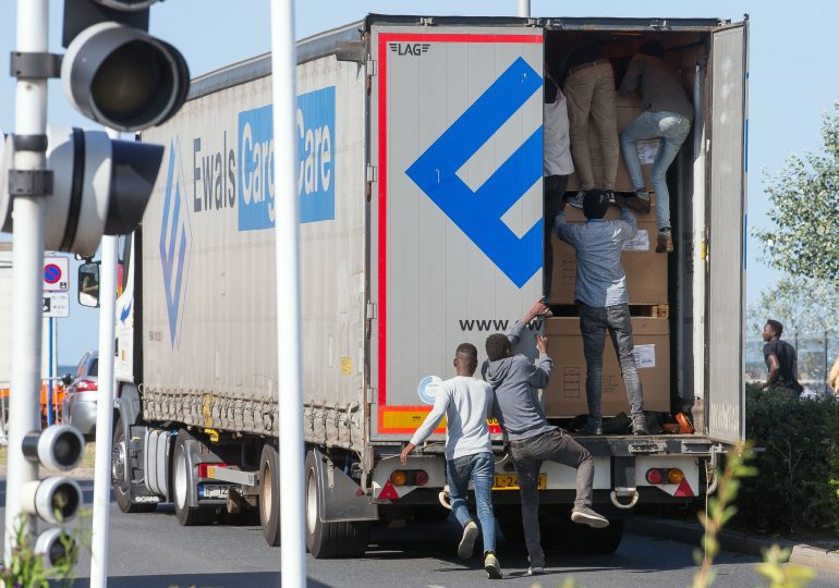 Foreign lorry drivers forced to plaster vans with signs to deter migrants trying to sneak into soft touch Britain